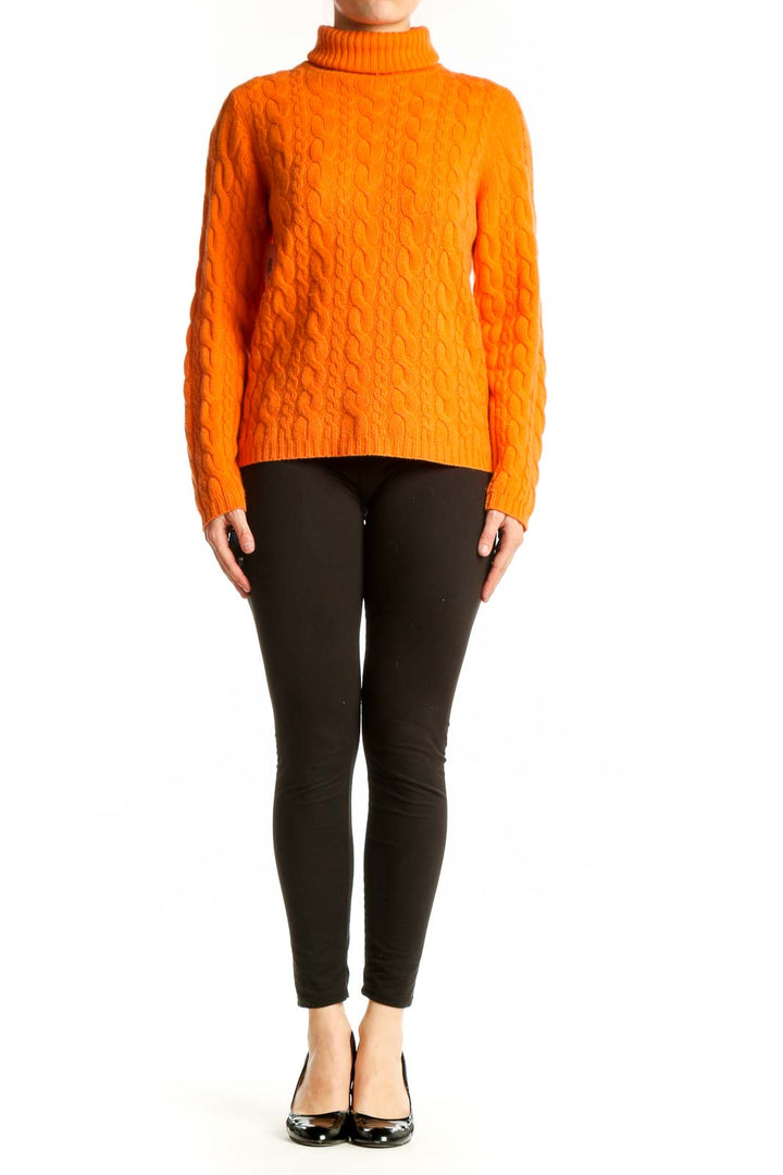 Orange cashmere cable knit turtleneck by DonCaster, front view showing intricate textured pattern and classic turtleneck collar