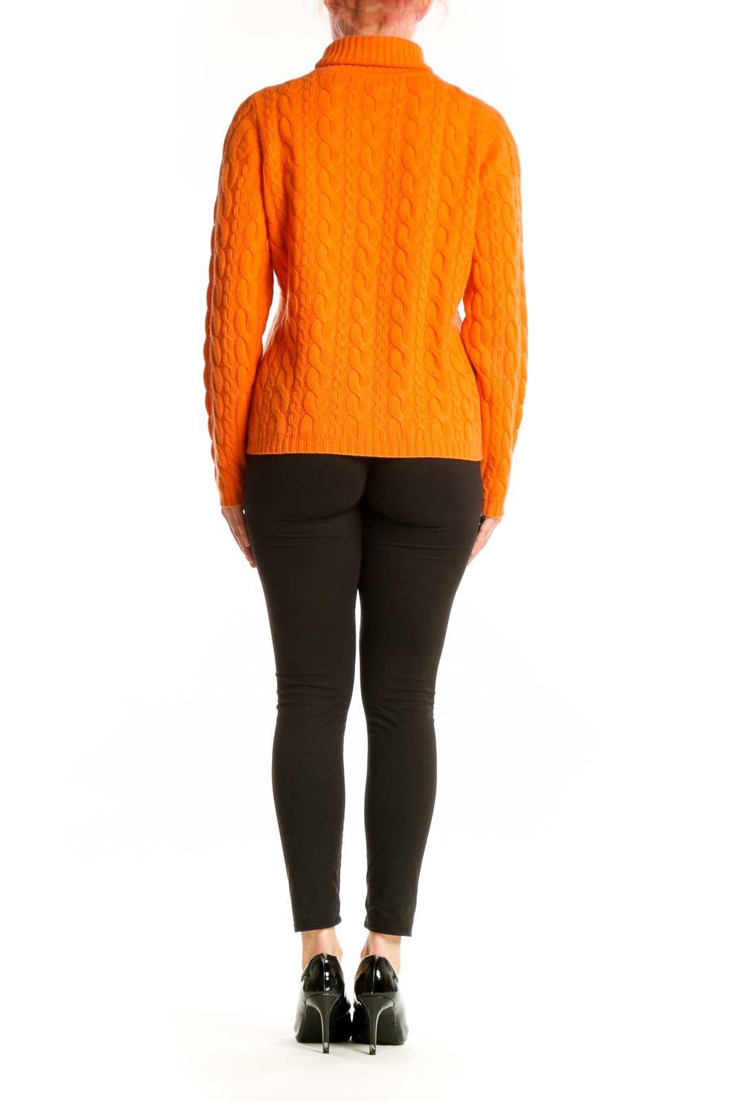 Orange cashmere cable knit turtleneck by DonCaster, back view displaying cable knit detailing and fitted silhouette