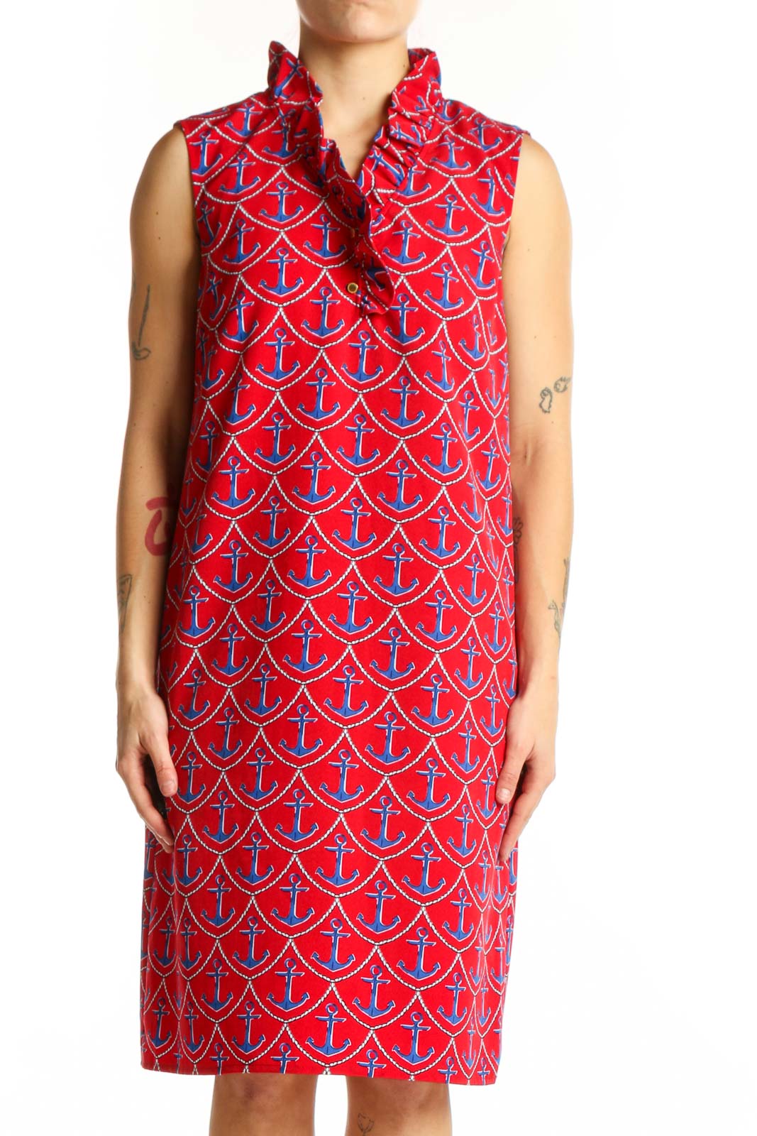 Red anchor print sleeveless shirt dress with button-front closure and collar neckline, displayed on model from front