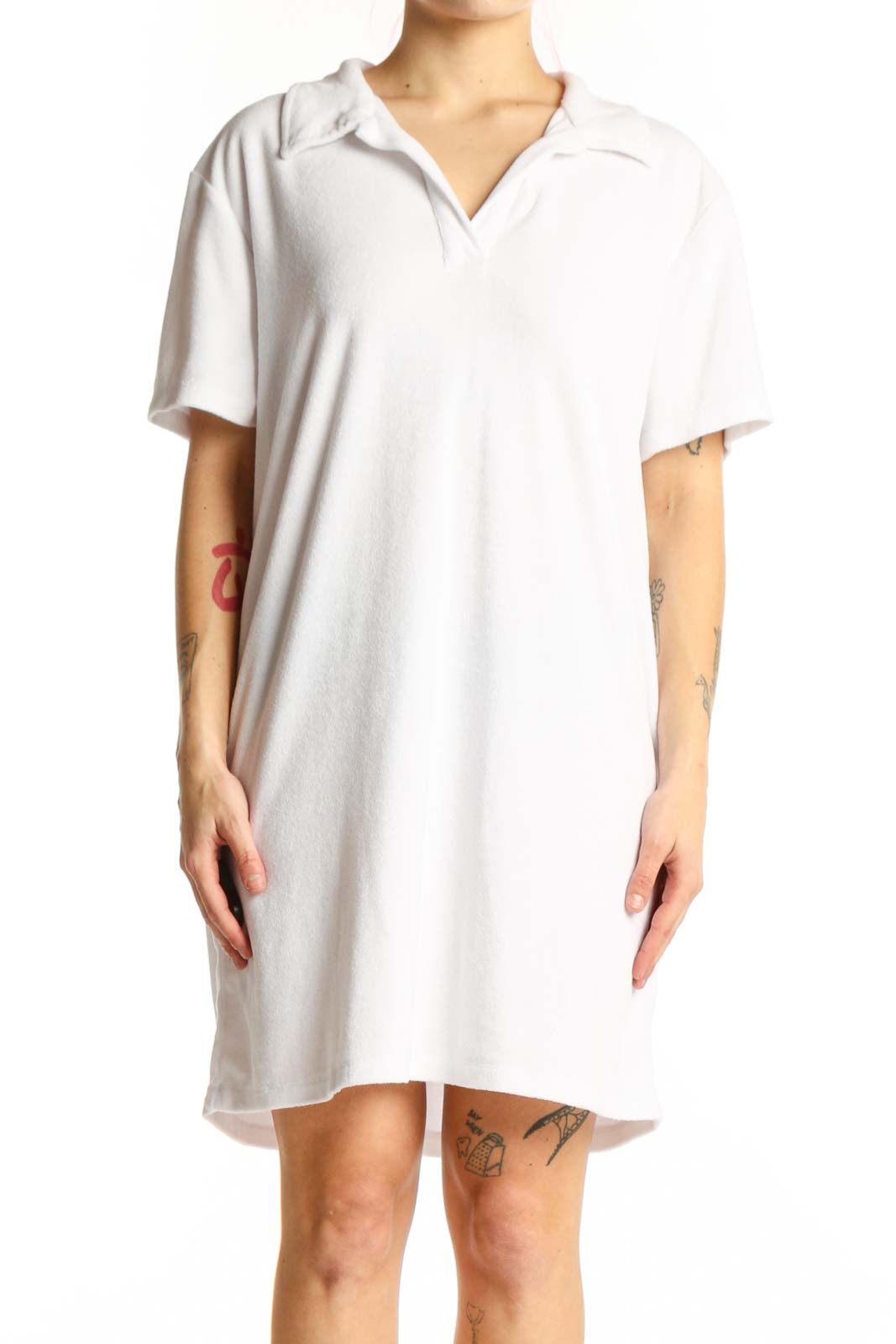 White polo shirt dress with short sleeves and collar, front view on model