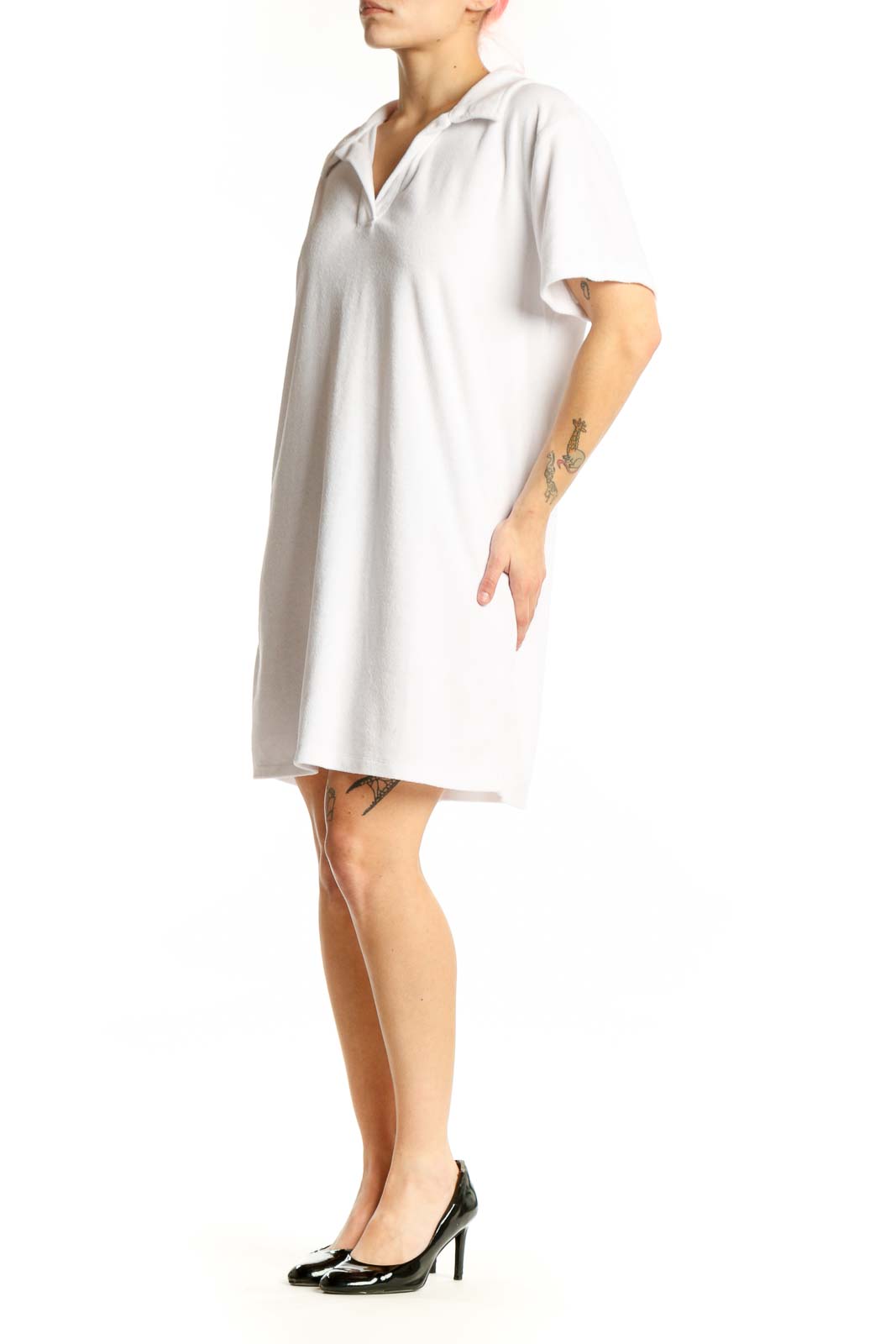 White polo shirt dress with short sleeves and collar, front view on model