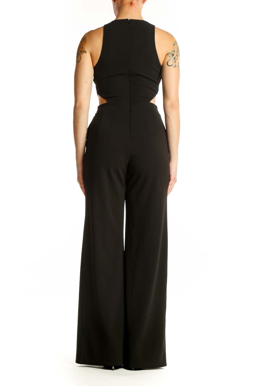 Black cutout jumpsuit with side cutout details and wide-leg pants, back view