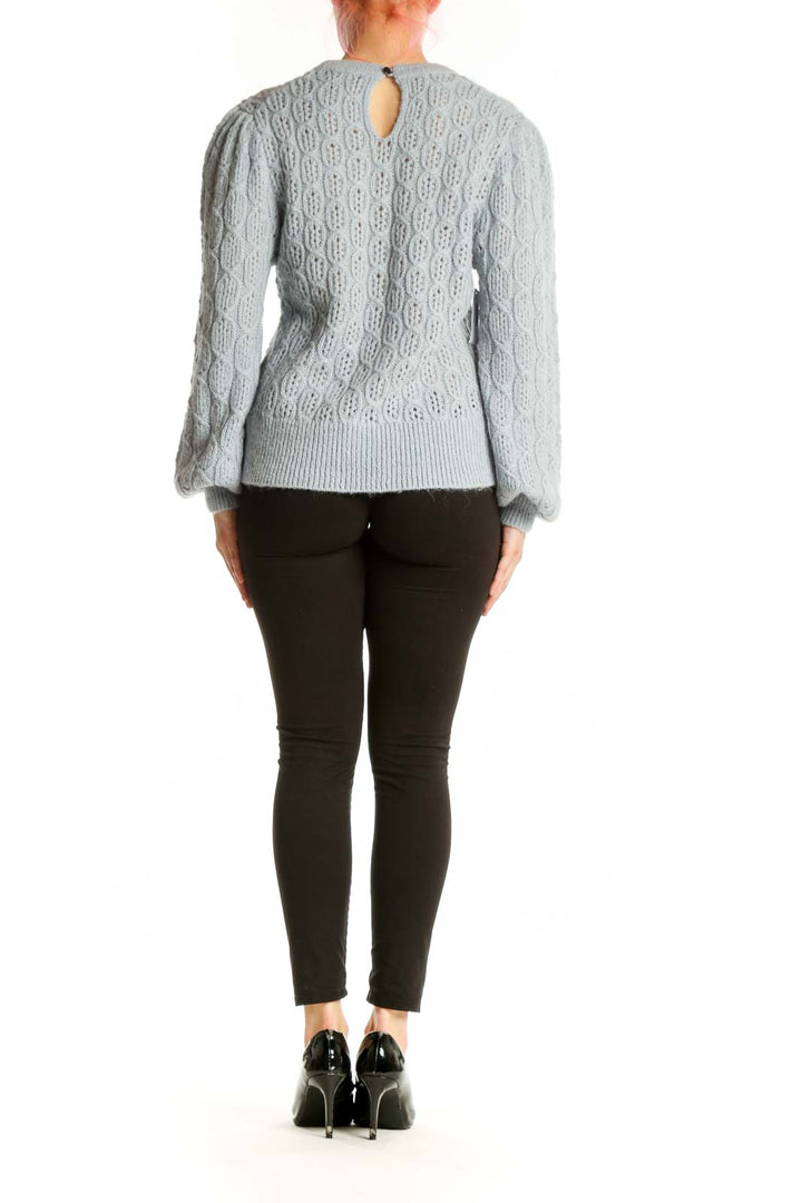 Gray cable knit pullover sweater with puffed sleeves, back view