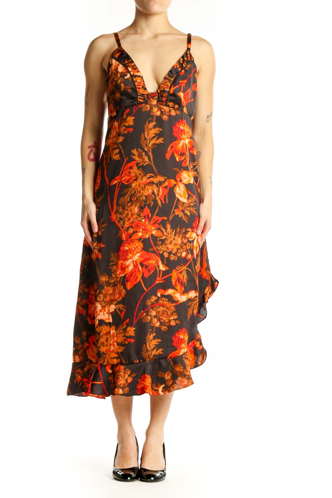 Black floral midi dress with orange and red blooms, ruffled V-neckline, and cascading ruffle hem - front view