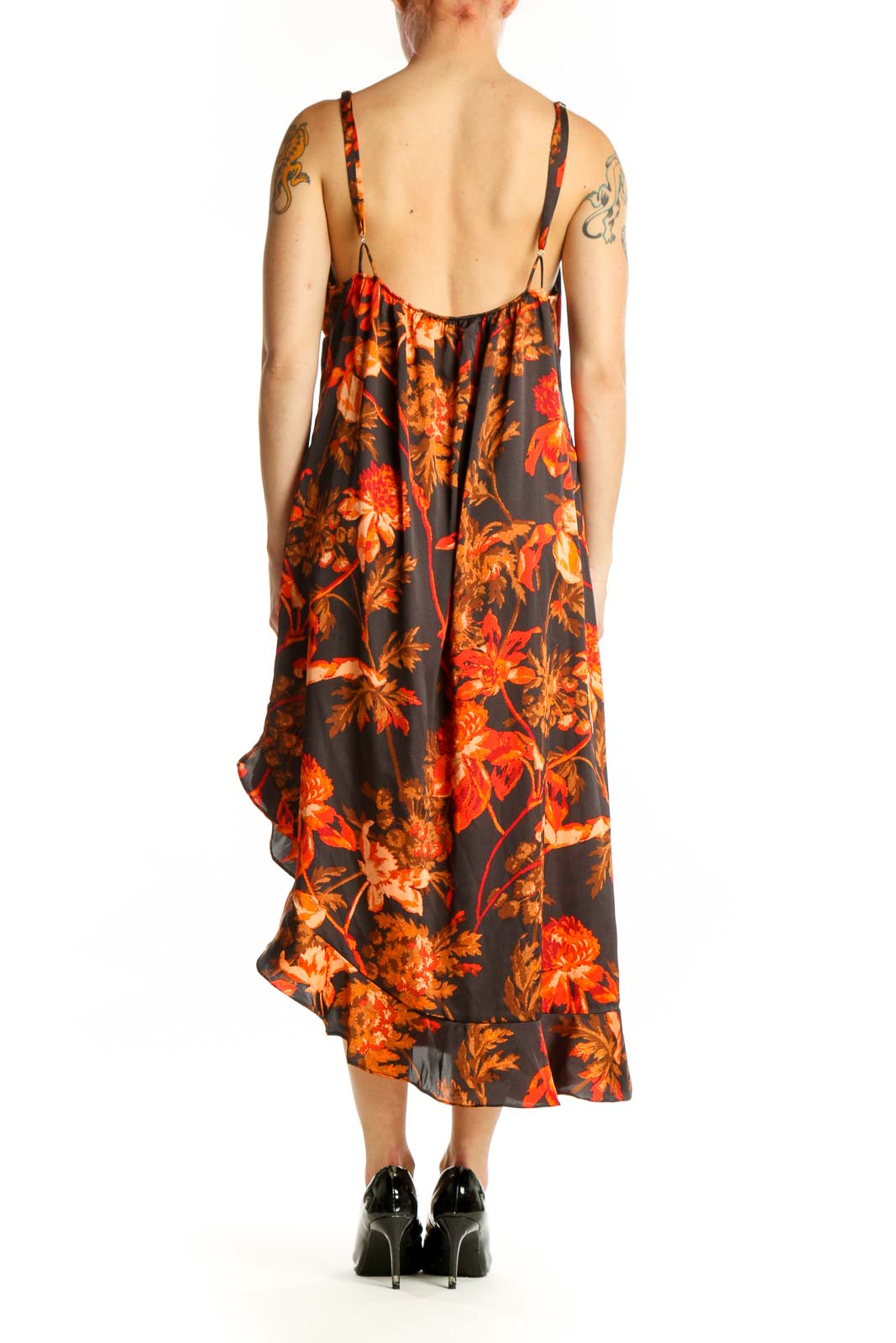 Black floral midi dress with orange and red blooms, ruffled V-neckline, and asymmetrical ruffle hem - back view