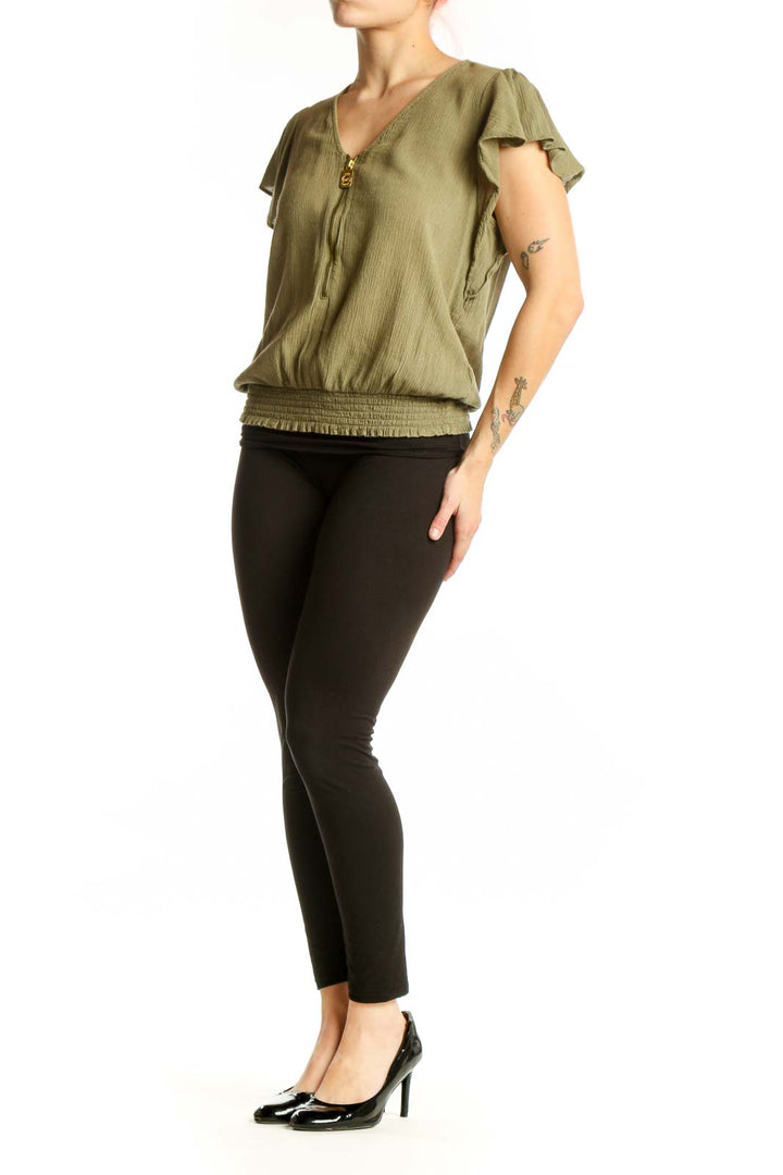 Sage green flutter sleeve blouson top with V-neckline and zip closure, front view