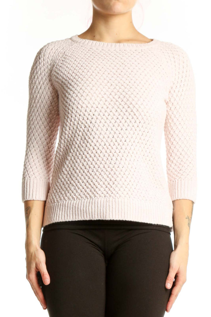 Cream cable knit pullover sweater with waffle texture and three-quarter sleeves, front view