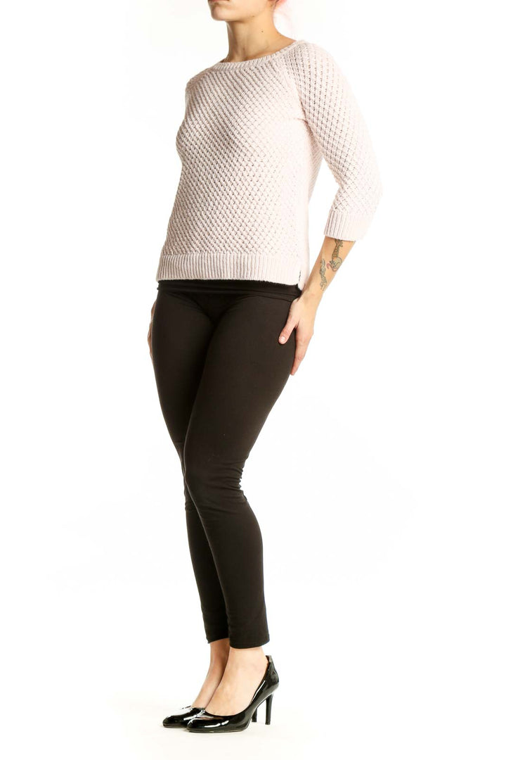 Cream cable knit pullover sweater with waffle texture and three-quarter sleeves, front view