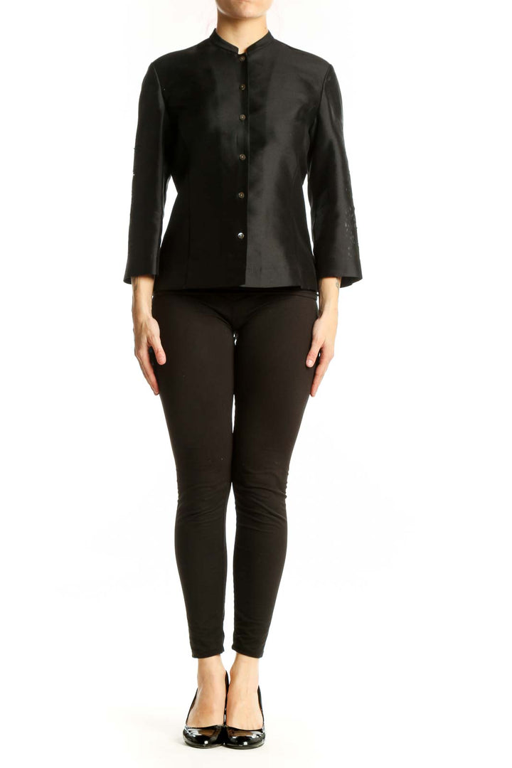 Black silk button-front jacket with mandarin collar and metallic buttons, front view
