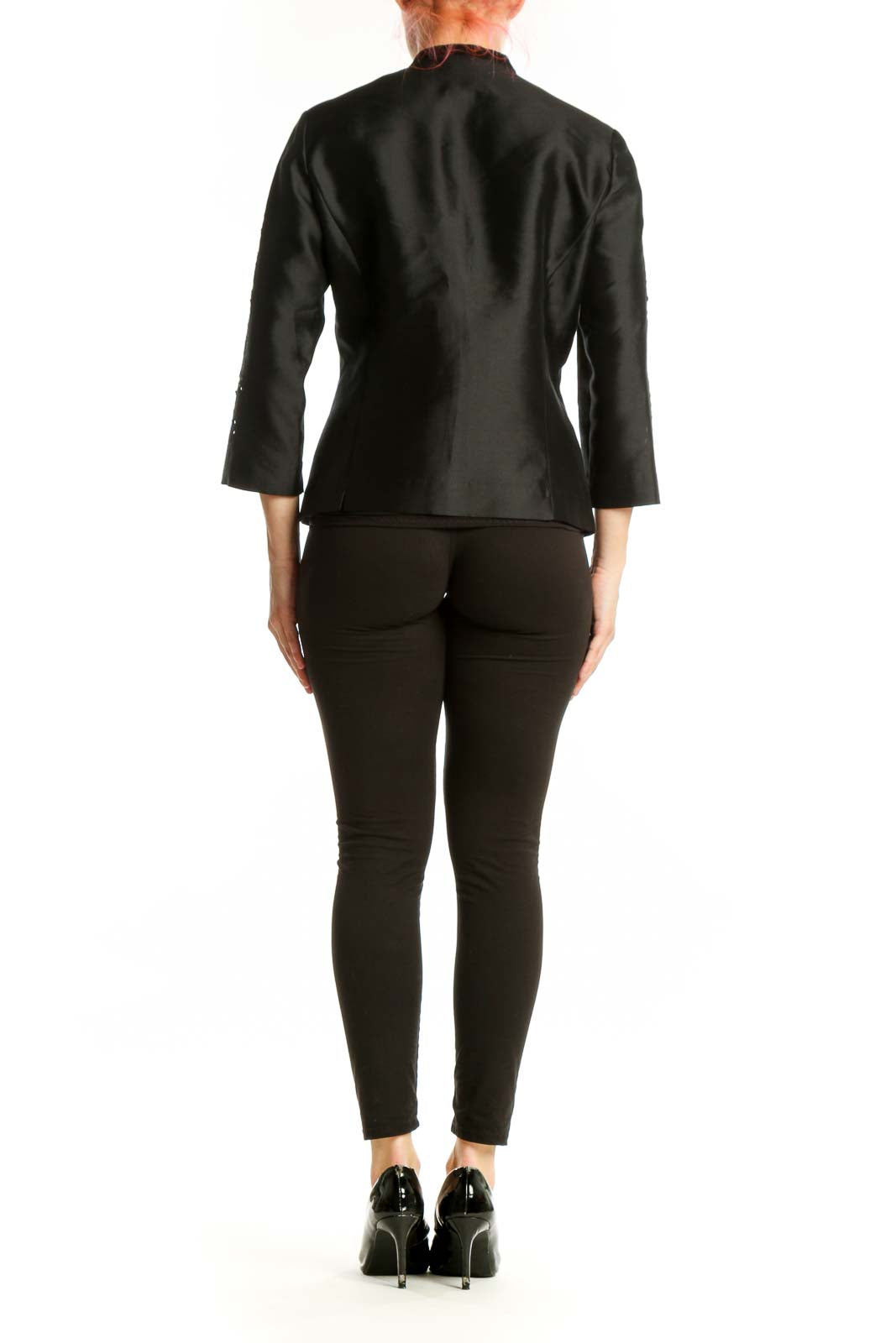 Black silk jacket back view showing beaded sleeve detailing and tailored fit