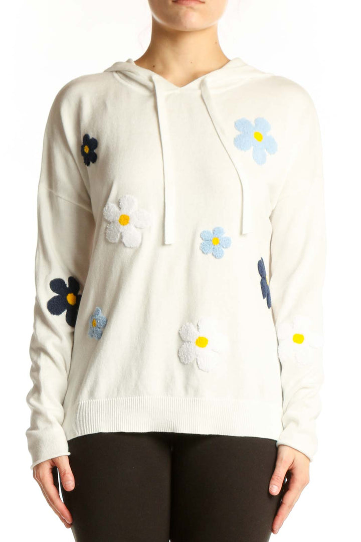 Cream cotton hoodie with colorful embroidered floral daisy design on front and sleeves