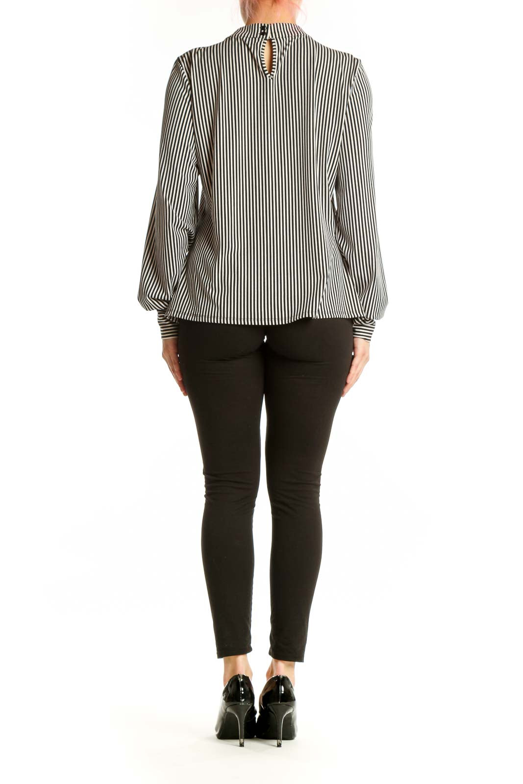 Back view of black and white striped blouse showing gathered neckline and elasticated cuff details