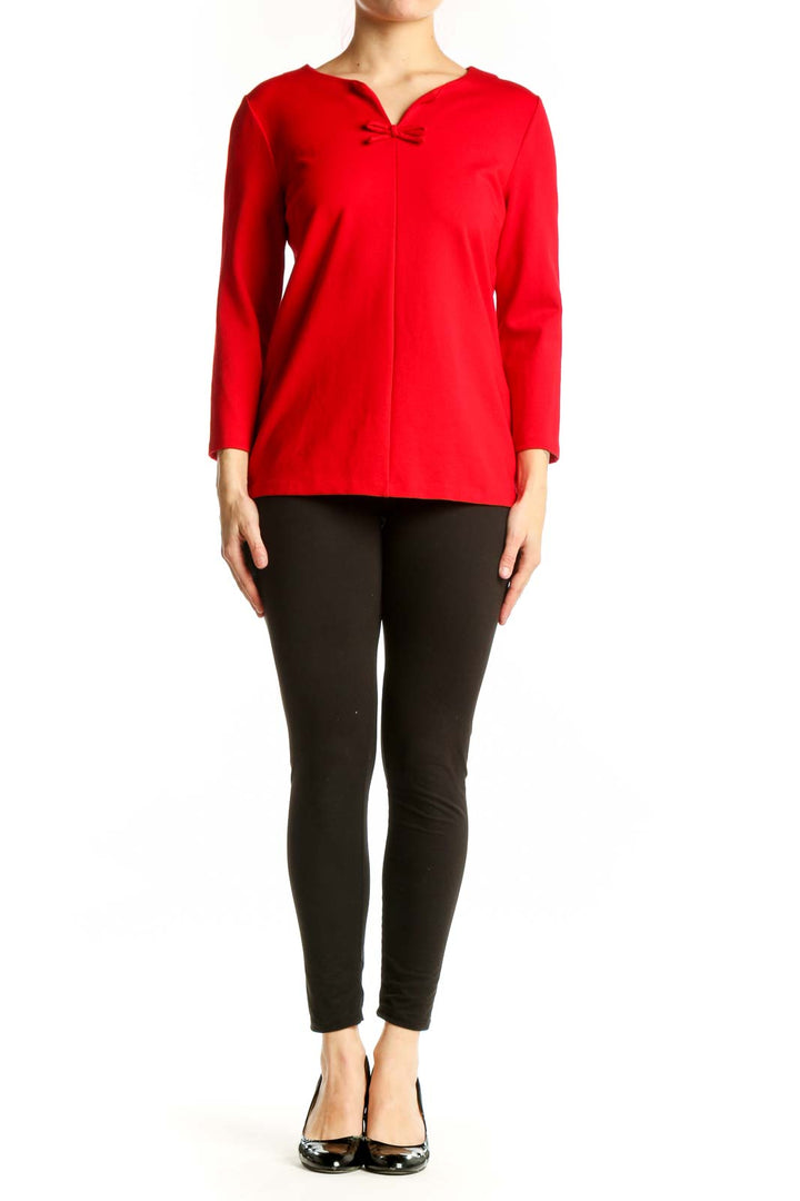 Red long sleeve top with bow neckline detail, front view on model