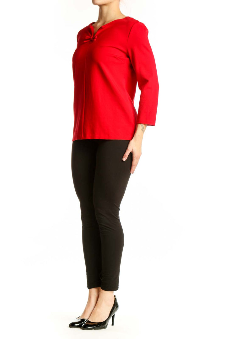 Red long sleeve top with bow neckline detail, front view on model