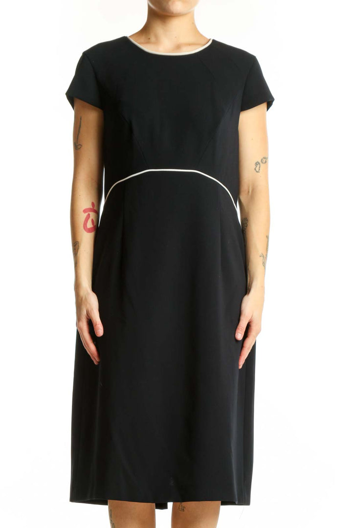 Black short sleeve A-line midi dress with white contrast waistline detail, front view
