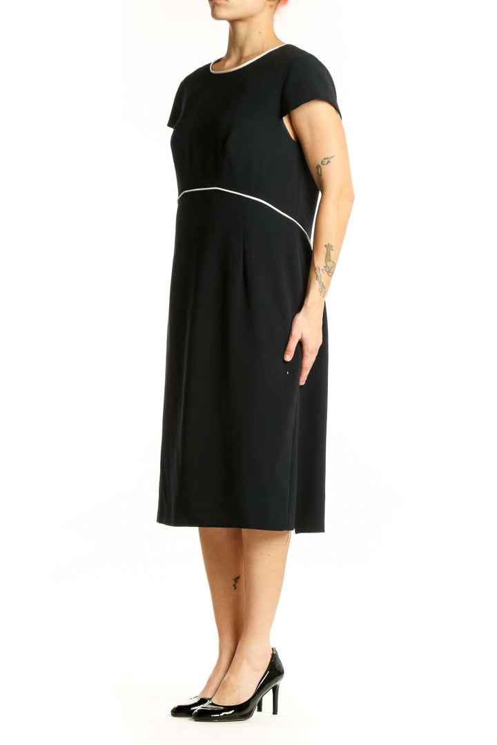 Black short sleeve A-line midi dress with white contrast waistline detail, front view