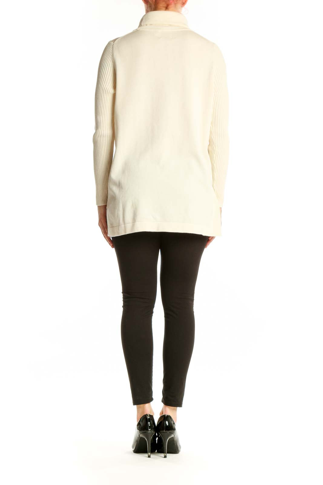 Back view of cream turtleneck knit sweater showing relaxed fit and ribbed sleeve detail
