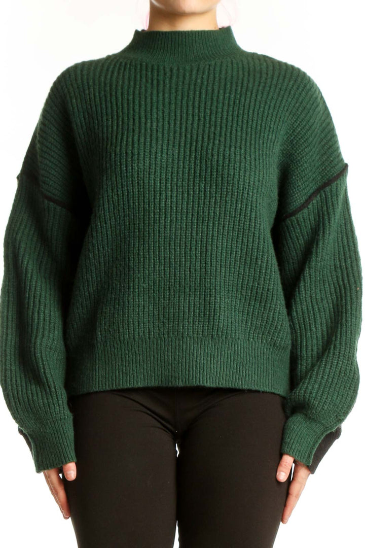 Forest green ribbed turtleneck pullover sweater with puffed sleeves and black trim detail, front view