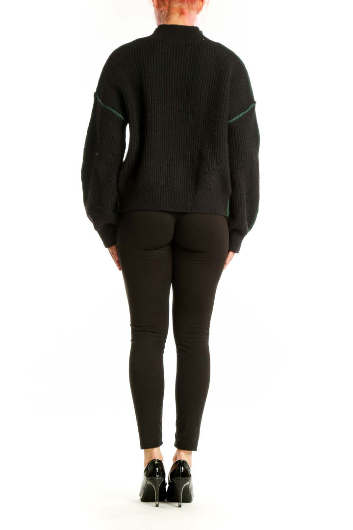 Forest green ribbed turtleneck pullover sweater with puffed sleeves, back view with black trim detailing