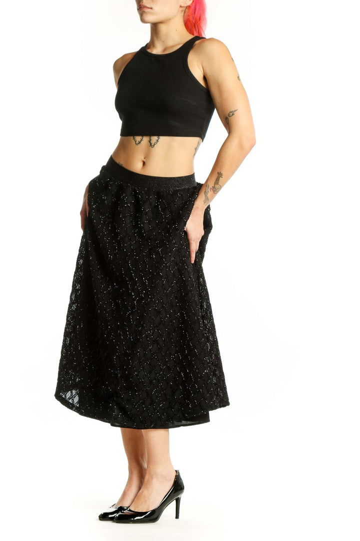 Black sparkle A-line midi skirt front view with glittering polyester fabric and elastic waistband