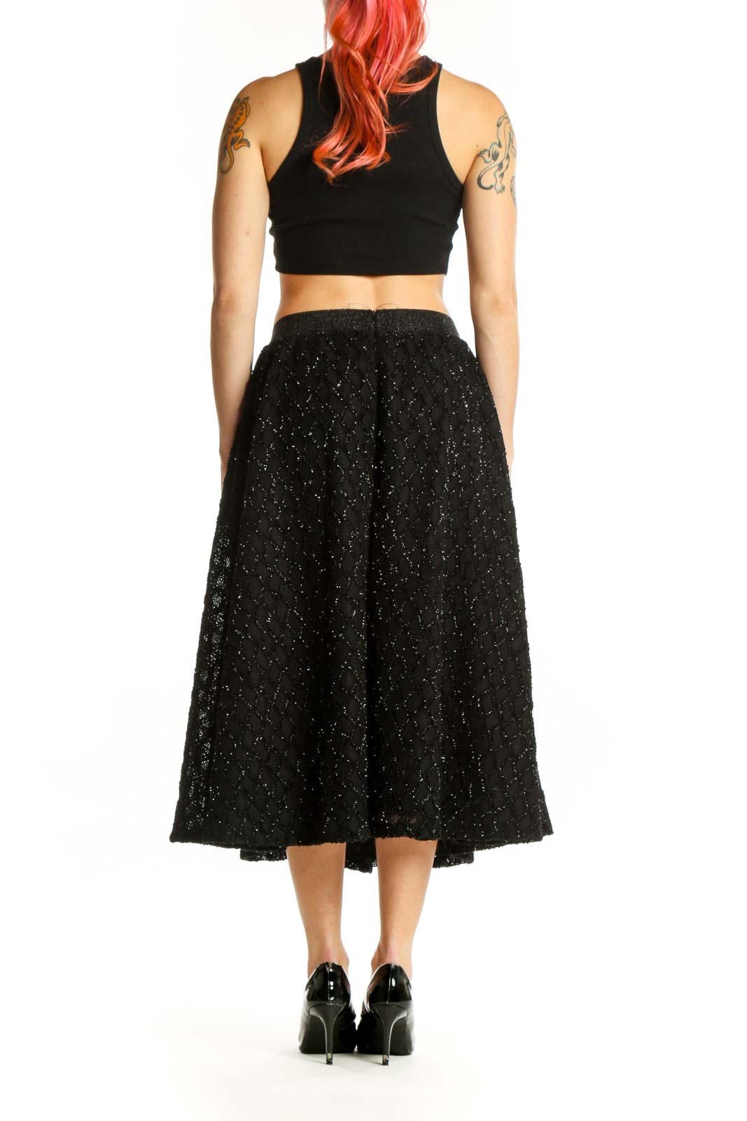 Black sparkle A-line midi skirt back view showing side pockets and elegant midi length silhouette