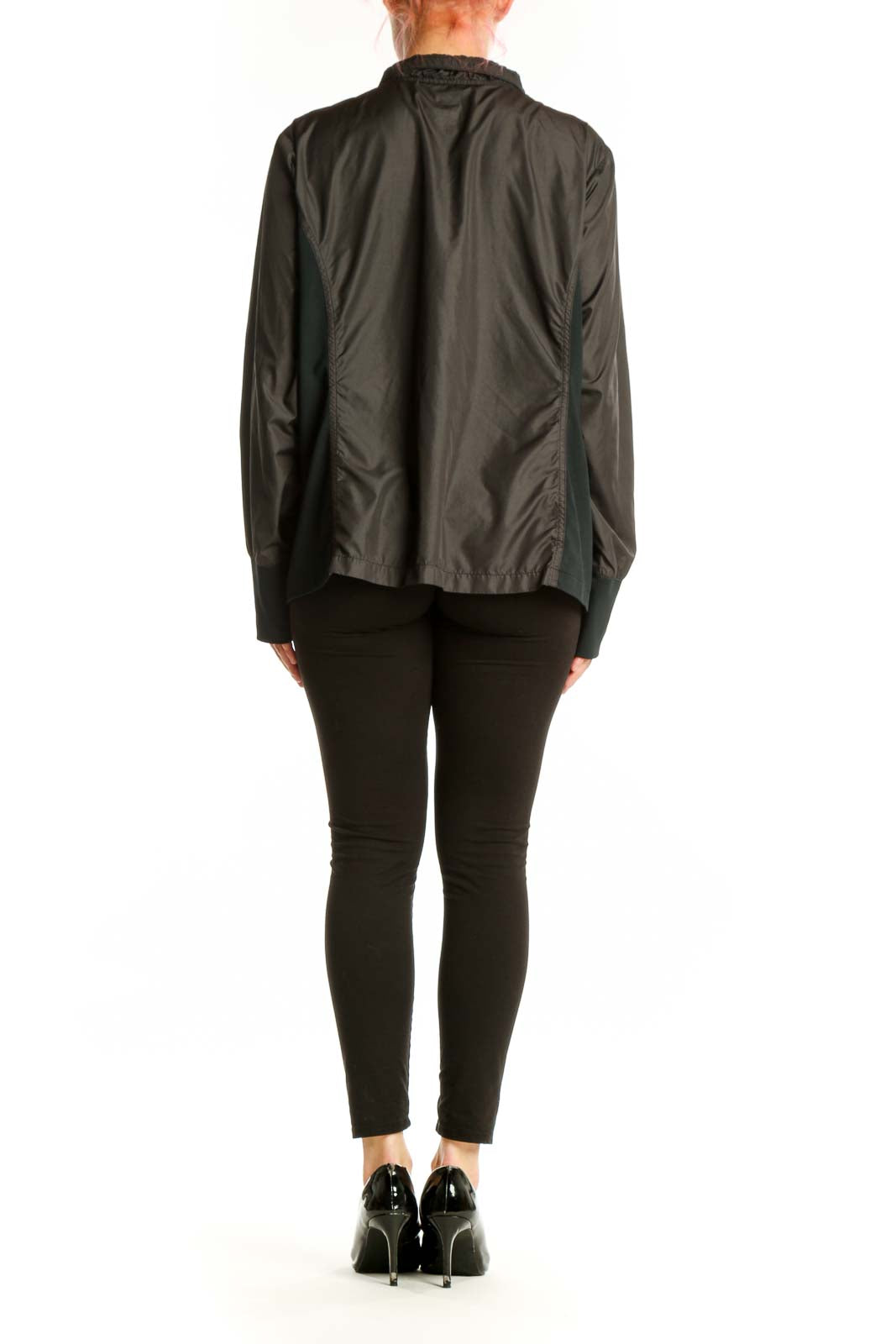 Black windbreaker jacket with pink accents, back view on model wearing black leggings