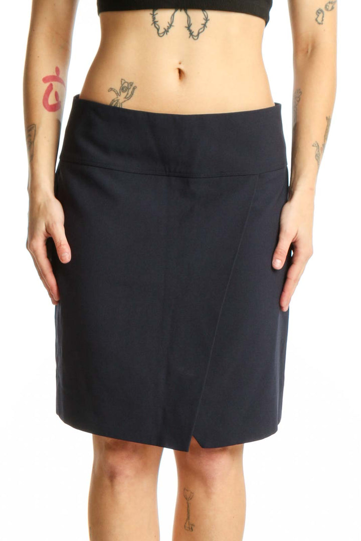 Navy wrap knee-length skirt with asymmetrical slit front view on model