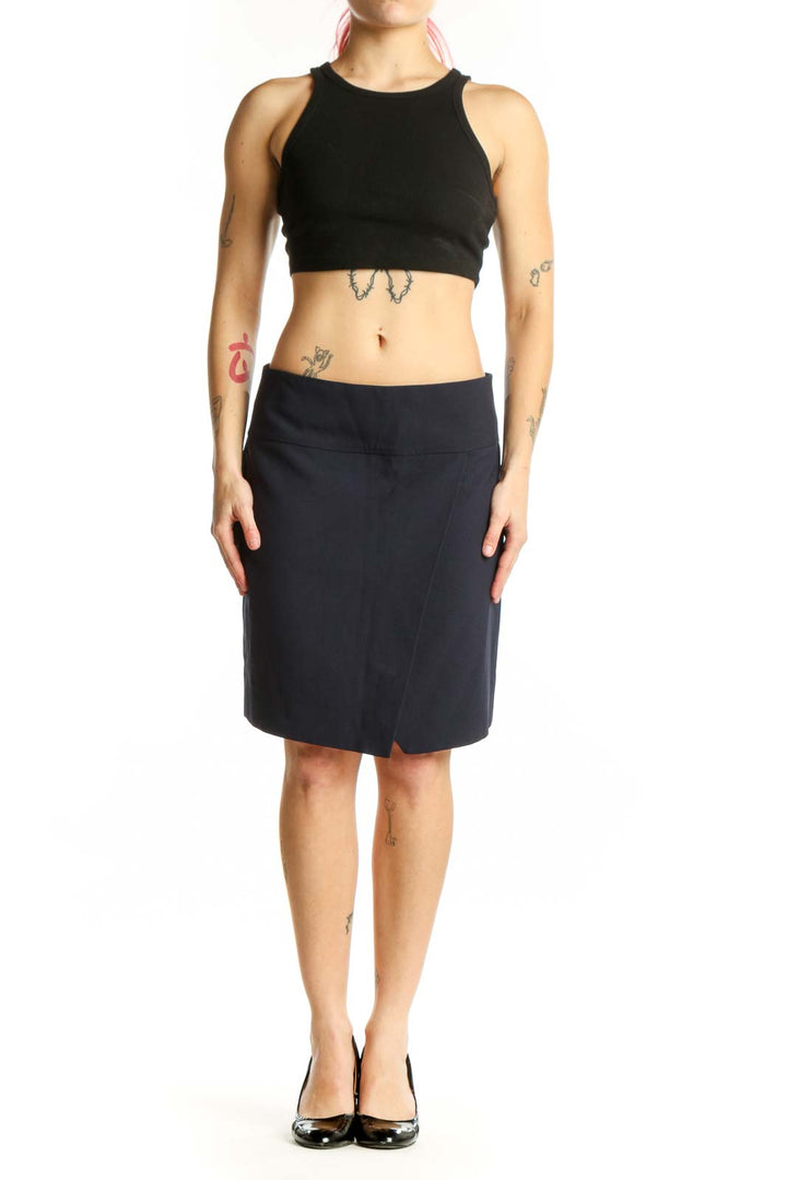 Navy wrap knee-length skirt with asymmetrical slit front view on model