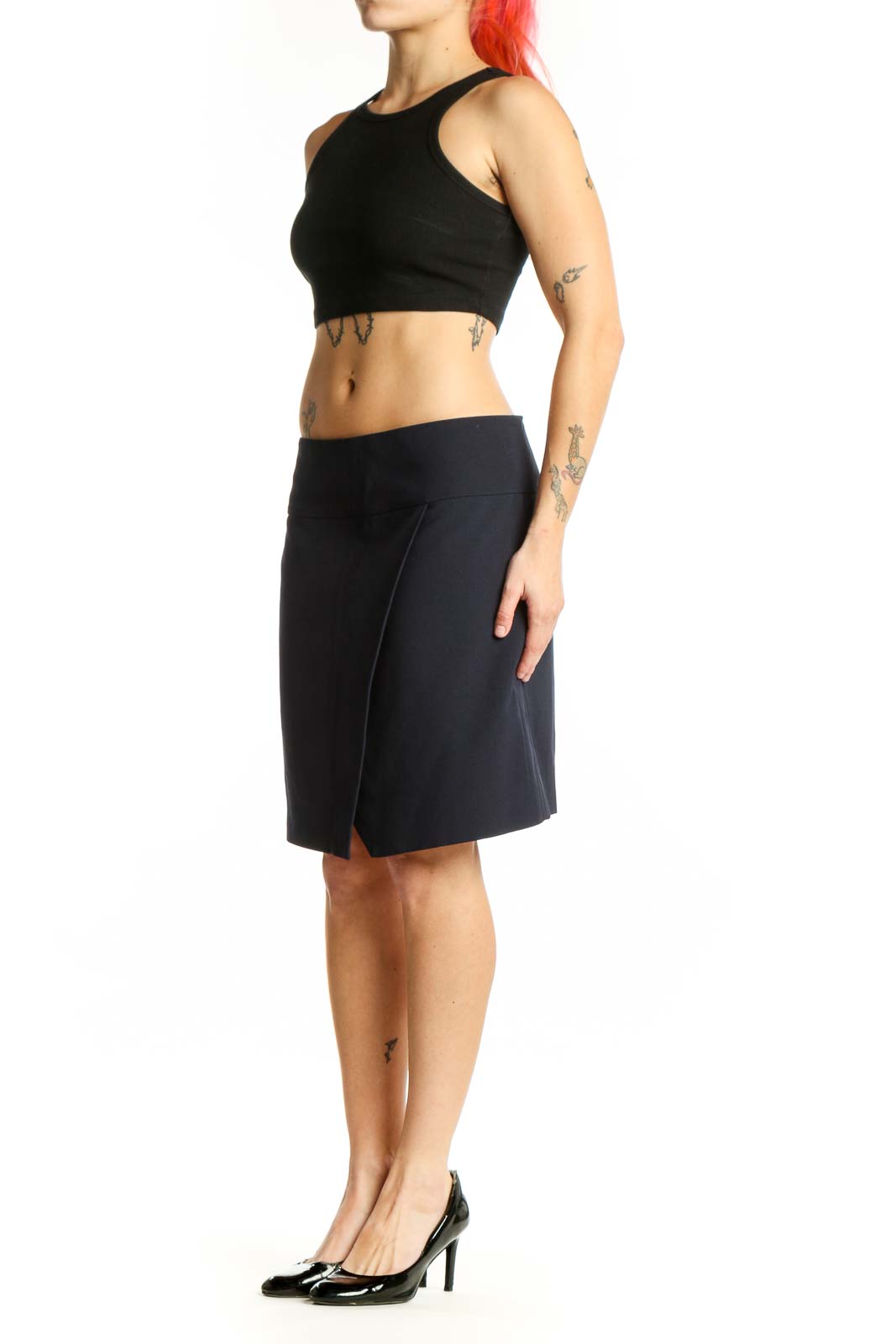 Navy wrap knee-length skirt with asymmetrical slit front view on model