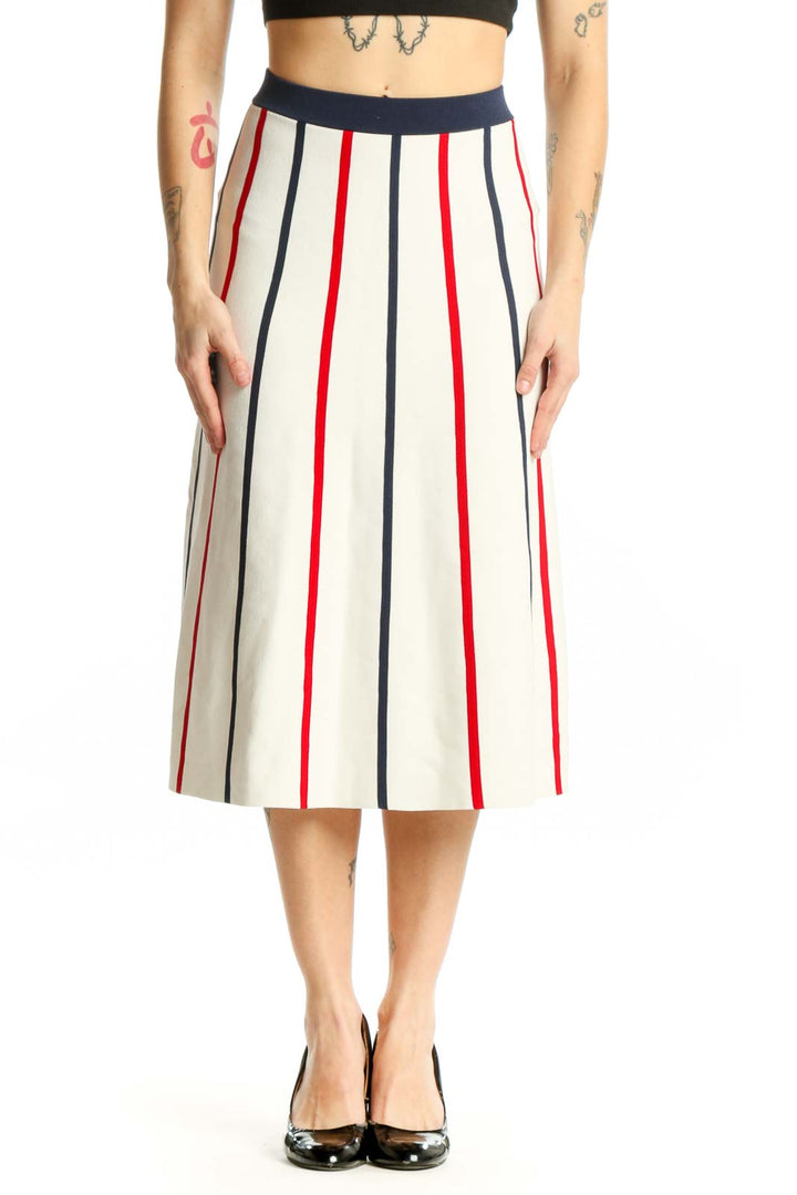 Front view of cream striped pleated midi skirt with navy and red vertical stripes by SilkRoll