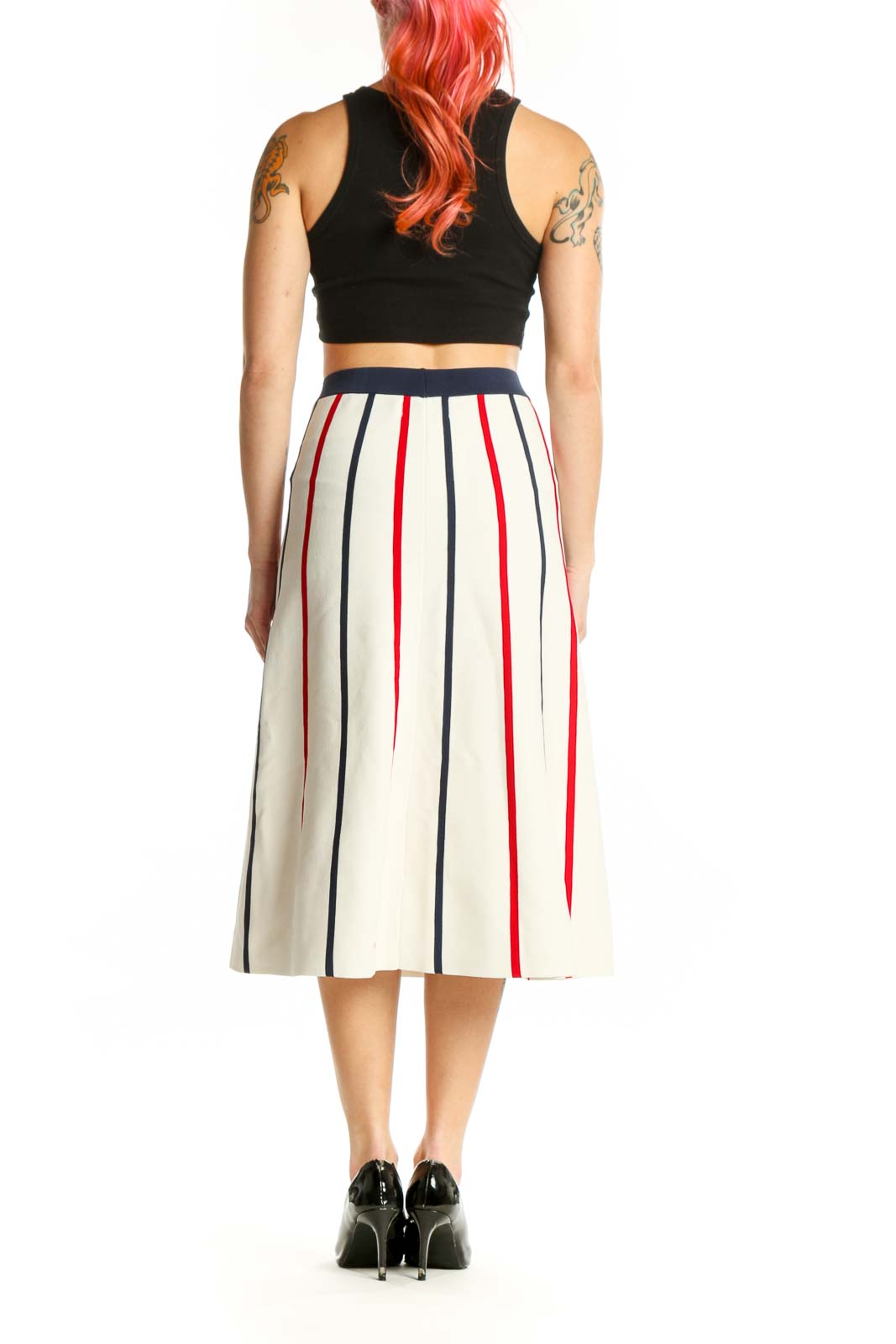 Back view of cream striped pleated midi skirt showing elegant drape and vertical stripe pattern