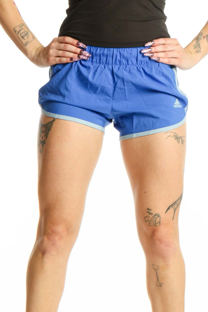 Front view of blue Adidas athletic shorts with elasticated waistband and contrast light blue lining