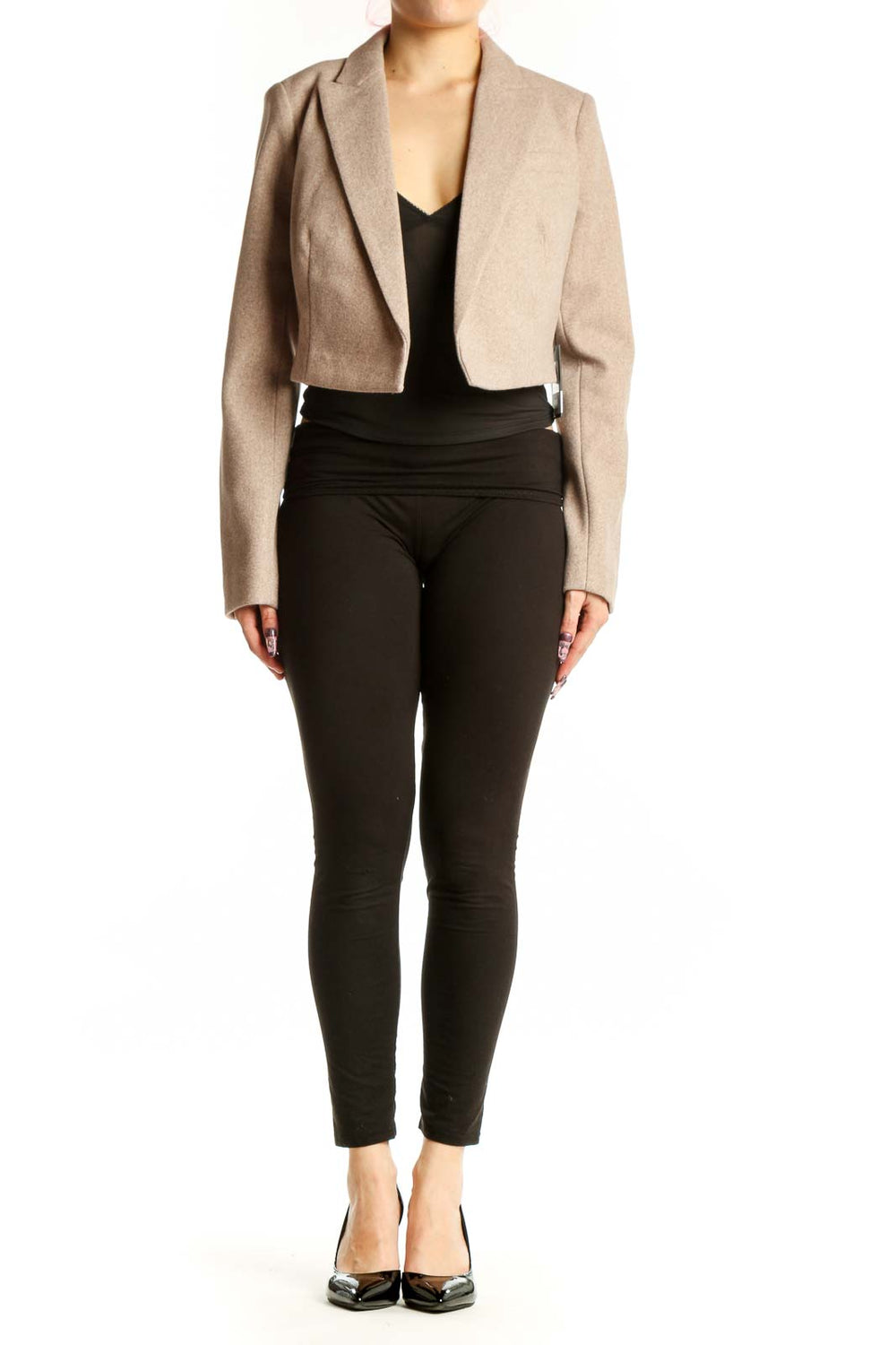 DKNY beige cropped blazer jacket with notch lapel worn over black top, front view