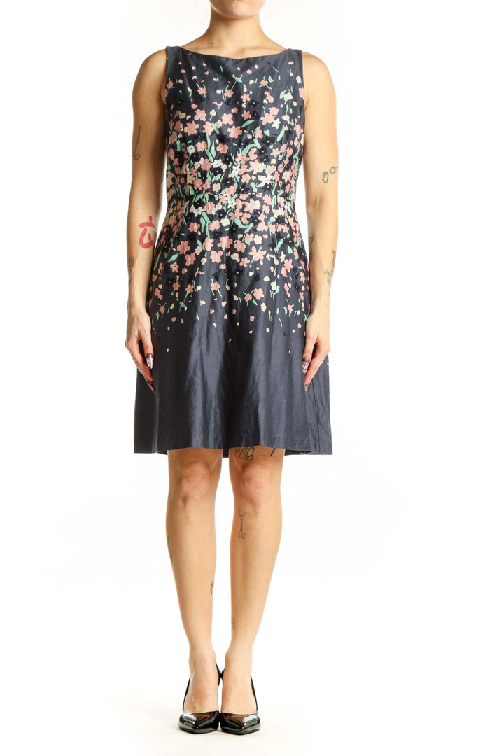 Navy floral A-line midi dress with pink and cream floral print, sleeveless crew neck design, front view