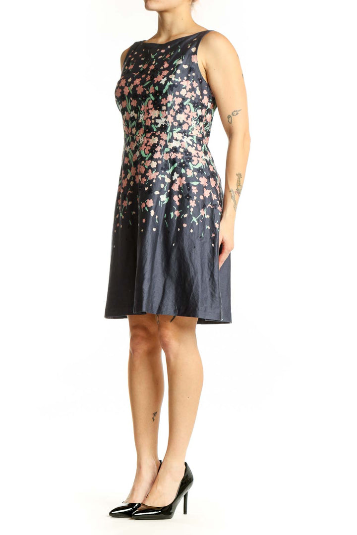 Navy floral A-line midi dress with pink and cream floral print, sleeveless crew neck design, front view