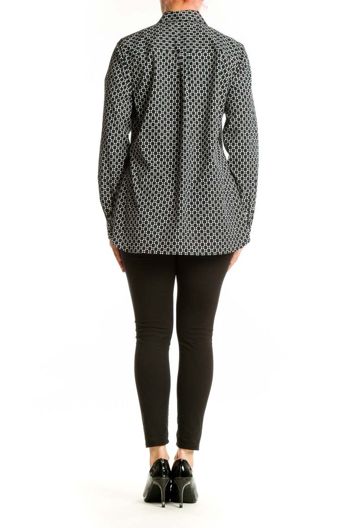 Black and white geometric print button-up shirt with long sleeves, back view