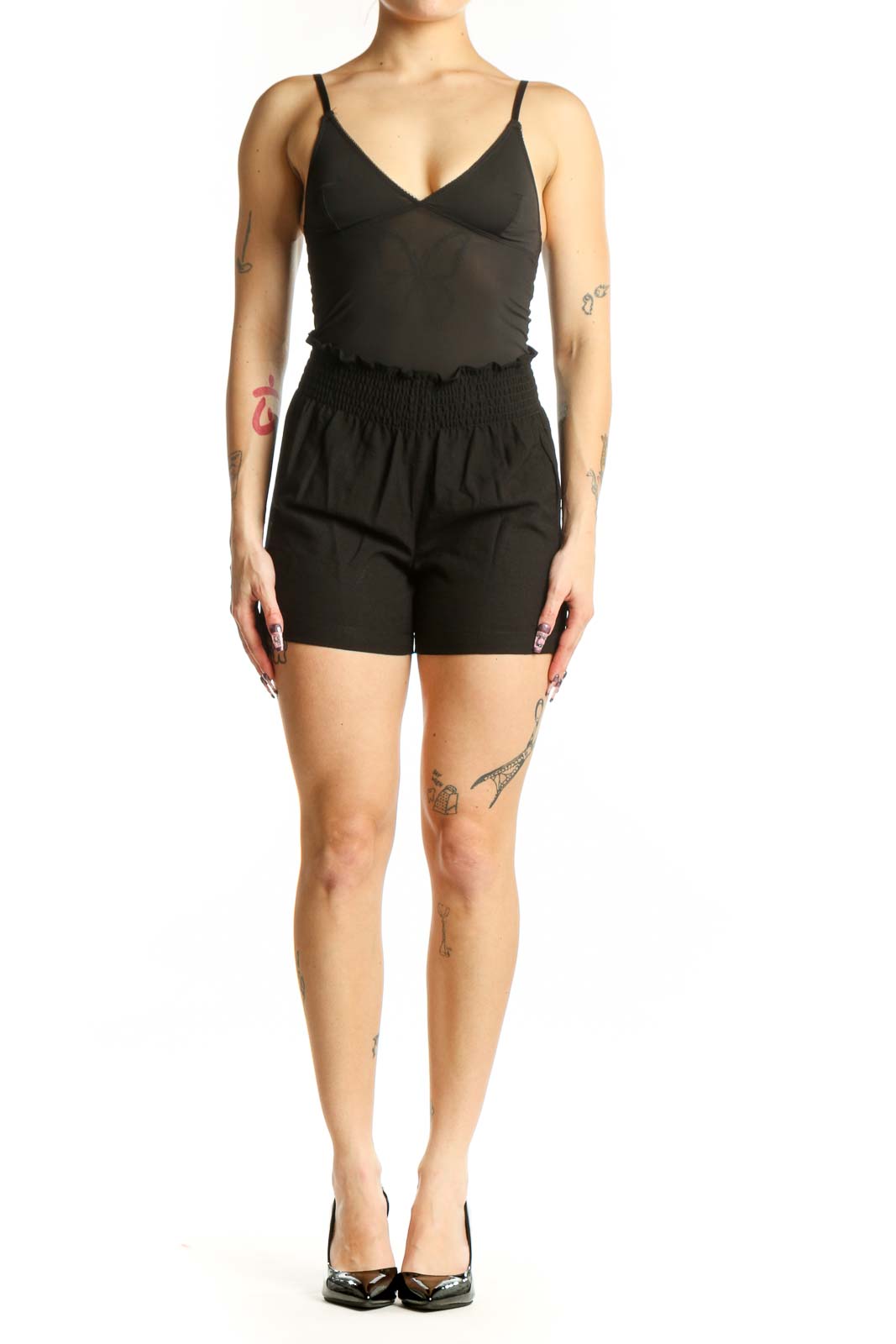 Black paperbag shorts with smocked waistband by Calvin Klein, front view on model