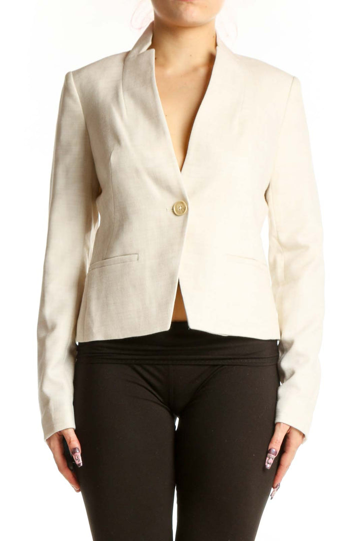 Front view of cream single button tailored blazer by Calvin Klein, XS size, featuring notch lapel and cropped length