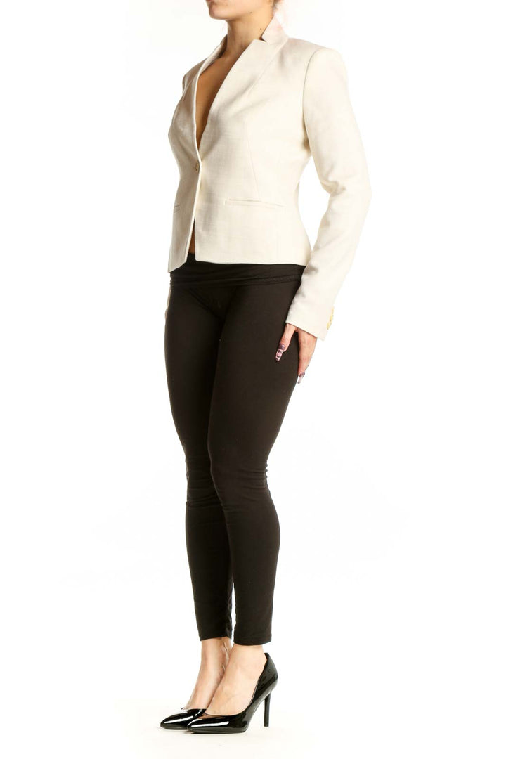 Front view of cream single button tailored blazer by Calvin Klein, XS size, featuring notch lapel and cropped length