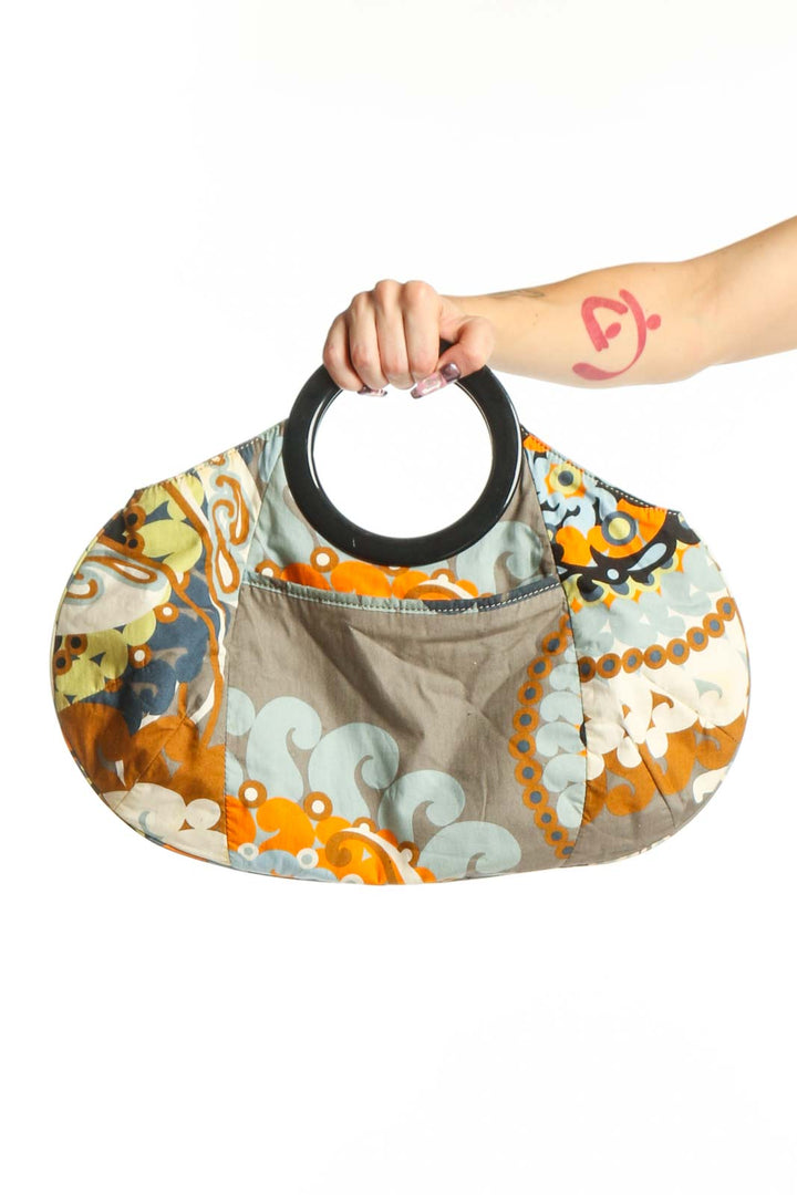 Multicolor floral cotton clutch by J.Crew with black handle, featuring vibrant orange, yellow, navy and cream ornamental print pattern