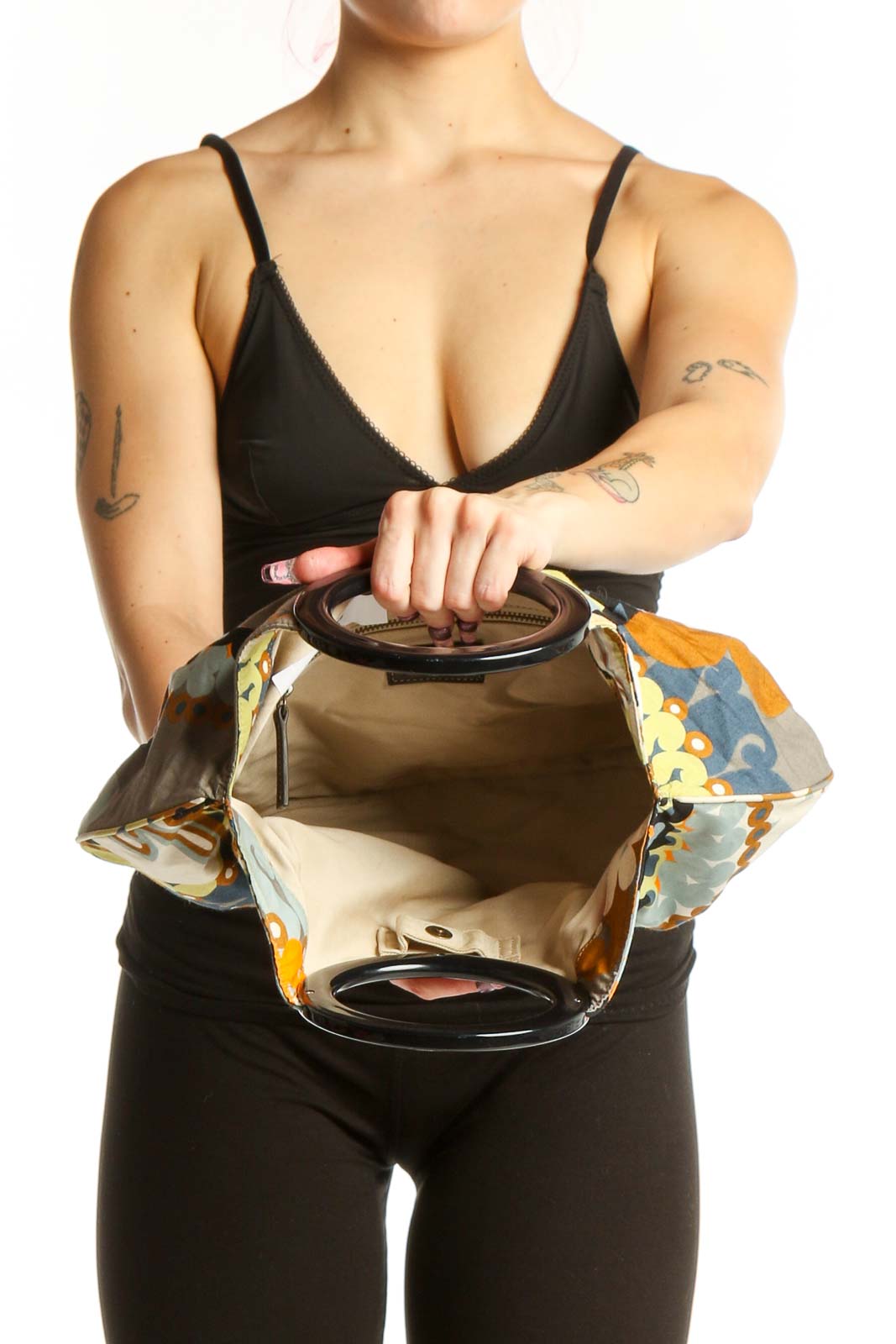 Back view of J.Crew multicolor floral cotton clutch showing gathered hobo silhouette and decorative pattern details