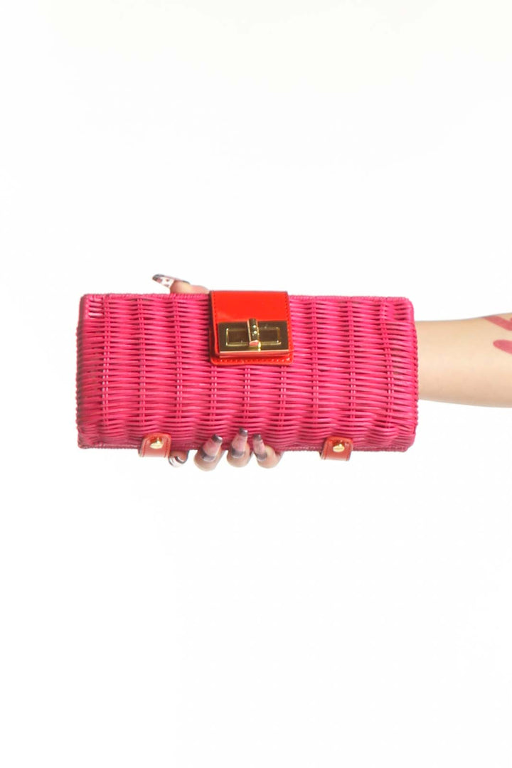 Pink woven straw and leather J.Crew clutch with red leather accent panel and gold metal clasp closure