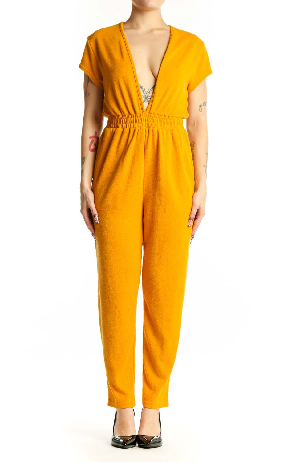 Gold deep V-neck short sleeve jumpsuit with elasticized waist and full-length pants, front view