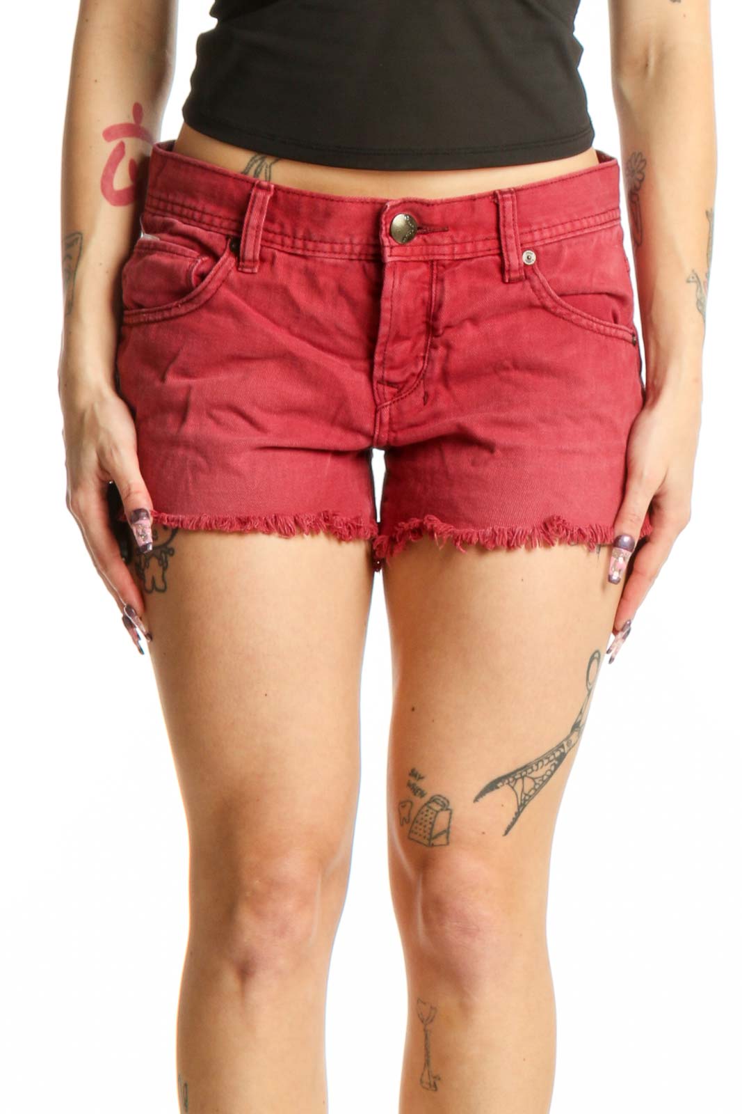 Red distressed cotton denim shorts with frayed hem and five-pocket design, front view