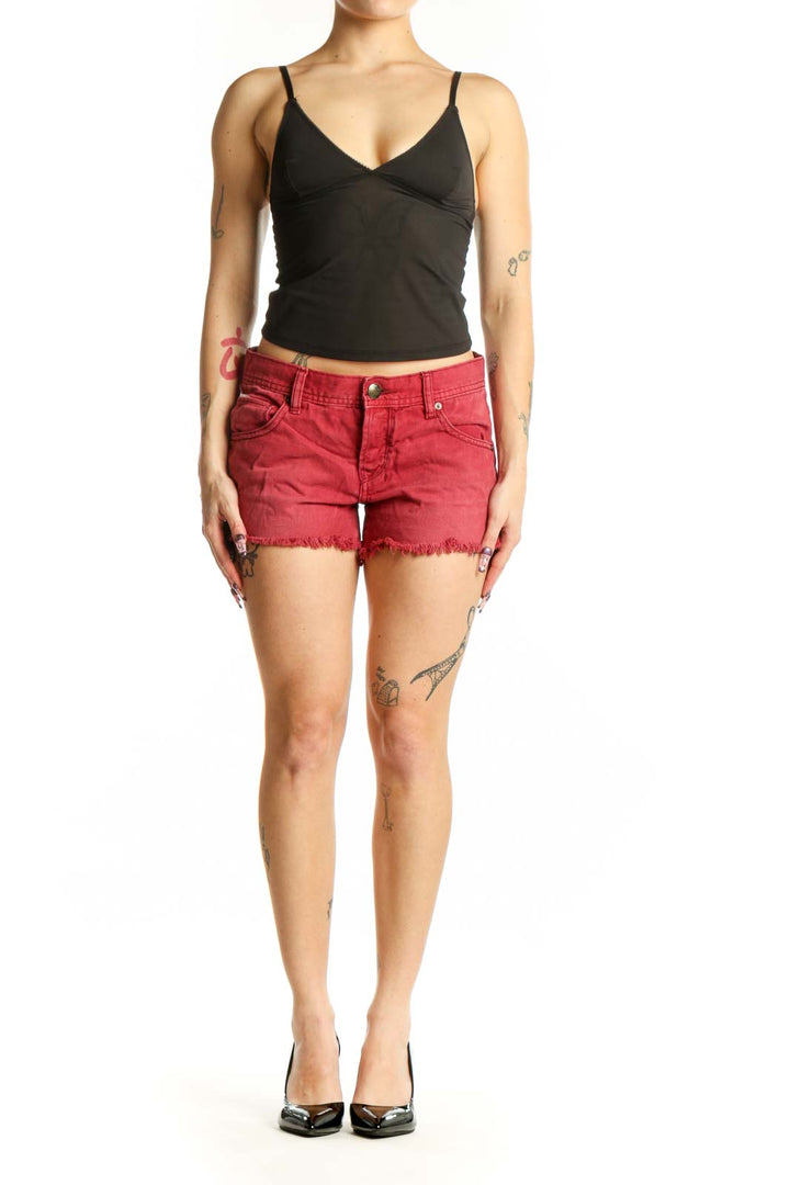 Red distressed cotton denim shorts with frayed hem and five-pocket design, front view