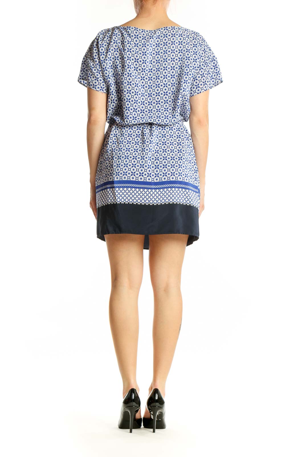 Blue and white geometric print short-sleeve dress with cinched waist and navy trim, back view