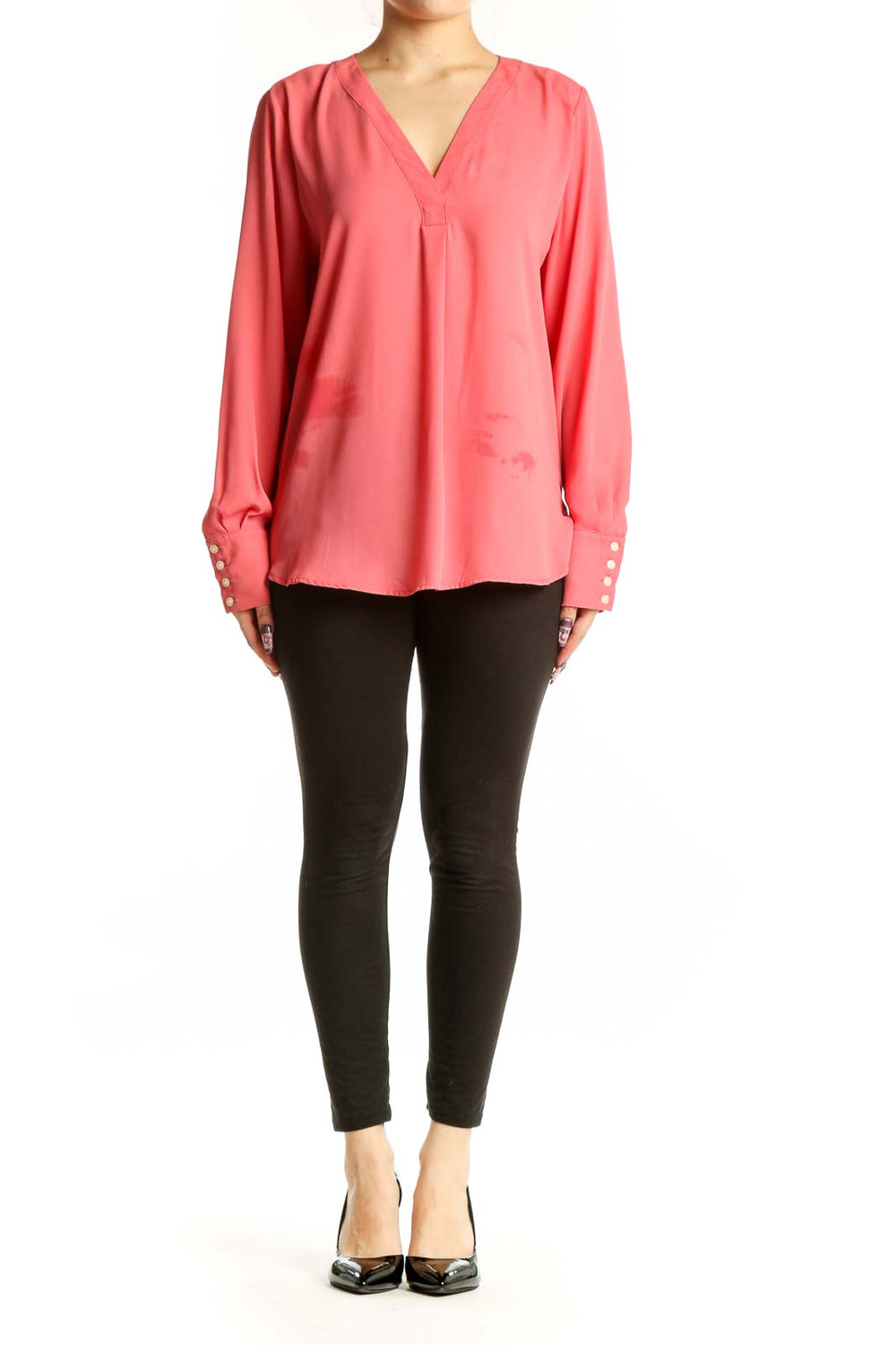 Coral pink V-neck long sleeve blouse by Ann Taylor with button cuff details, front view on model