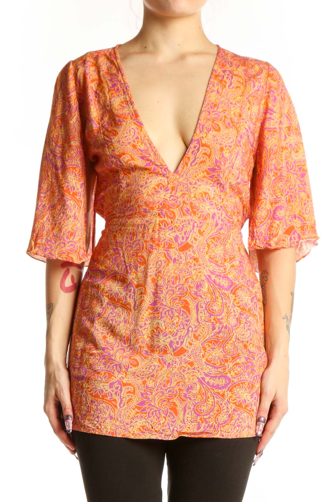 Orange and pink paisley print wrap top with V-neckline and three-quarter sleeves by VIX by Paula Hermanny