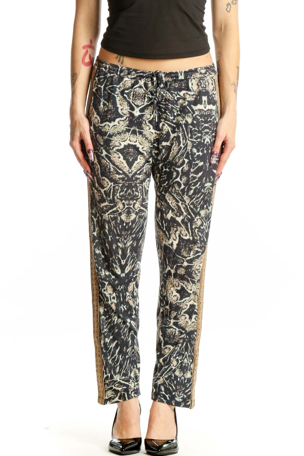 Black and cream floral print modal pants with gold metallic side trim, front view on model