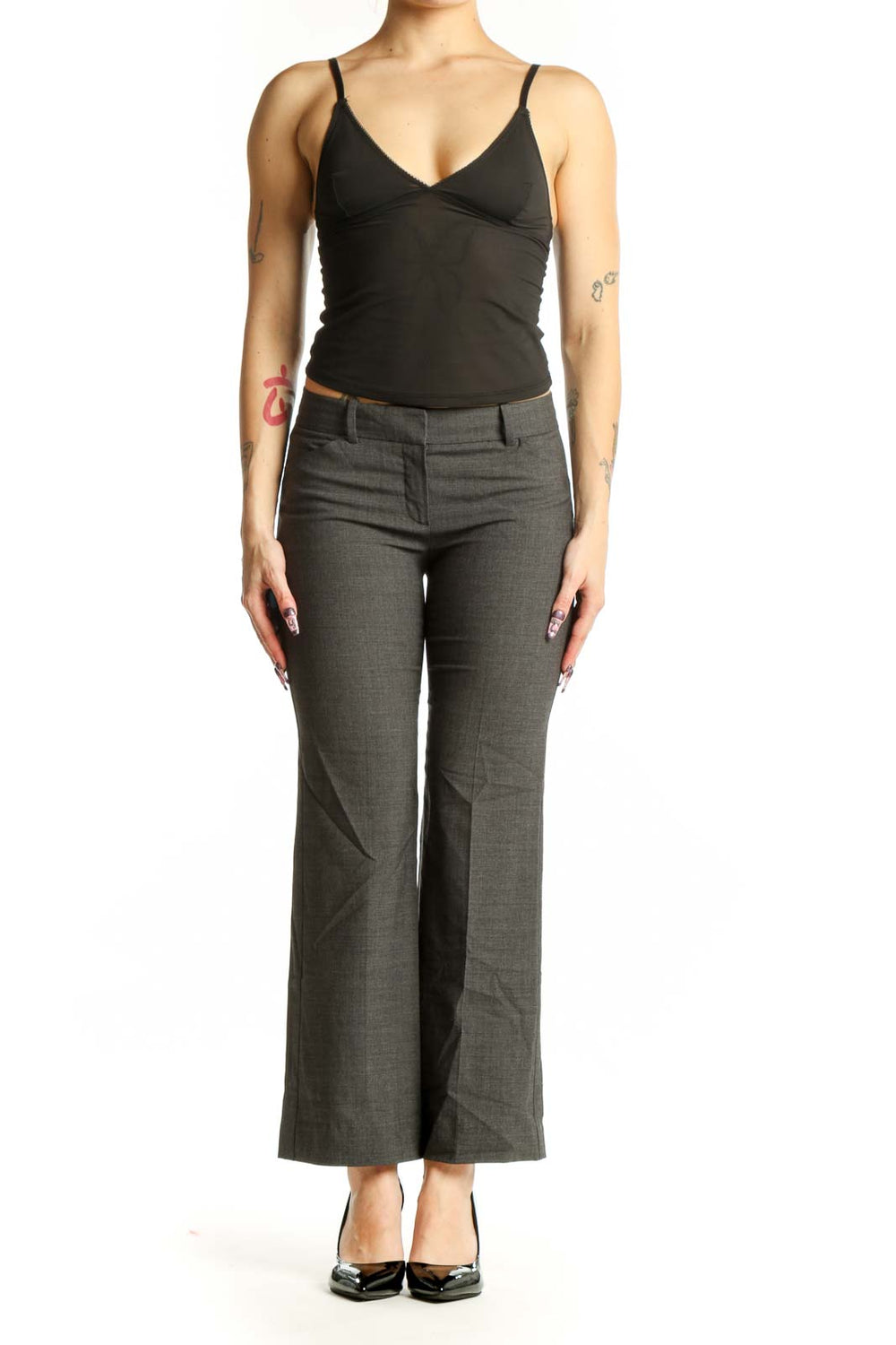 Front view of gray Theory dress pants with tailored flat-front design and mid-rise waist on model wearing black top
